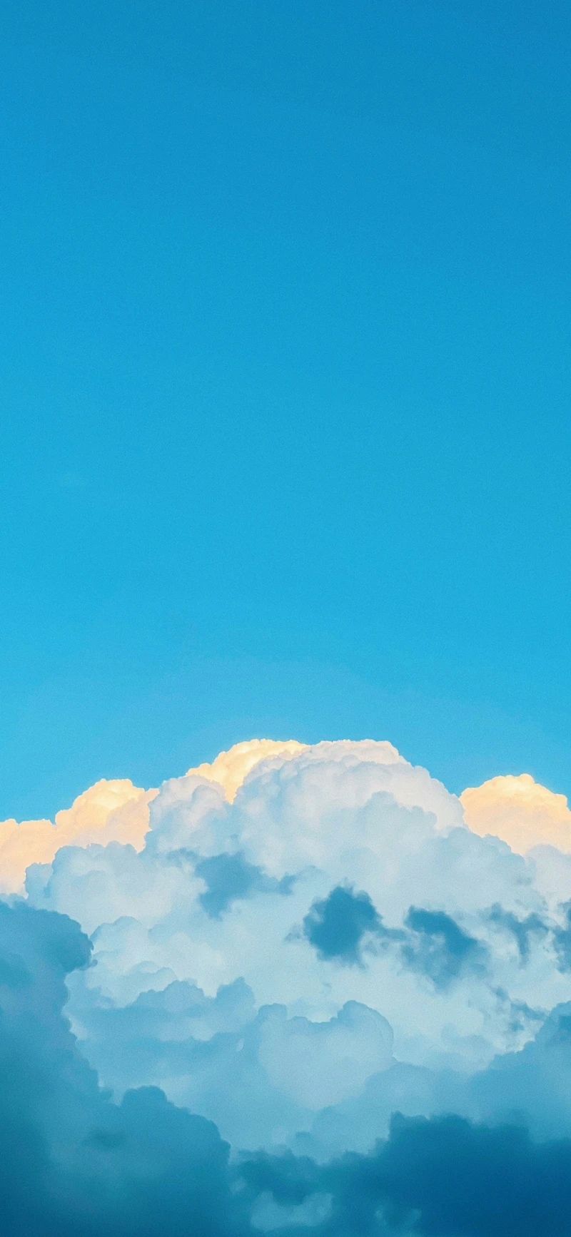 dreamy blue sky golden clouds