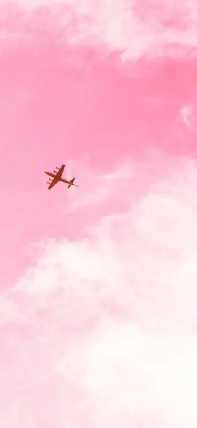 dreamy pink sky airplane clouds