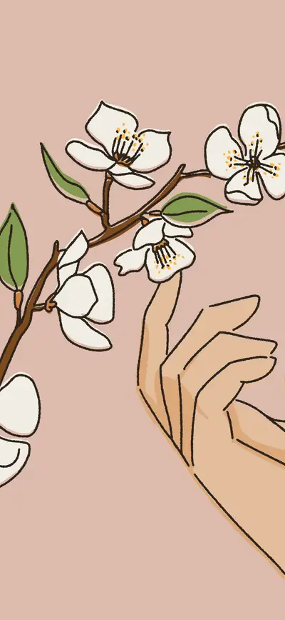 neutral boho hand holding cherry blossom