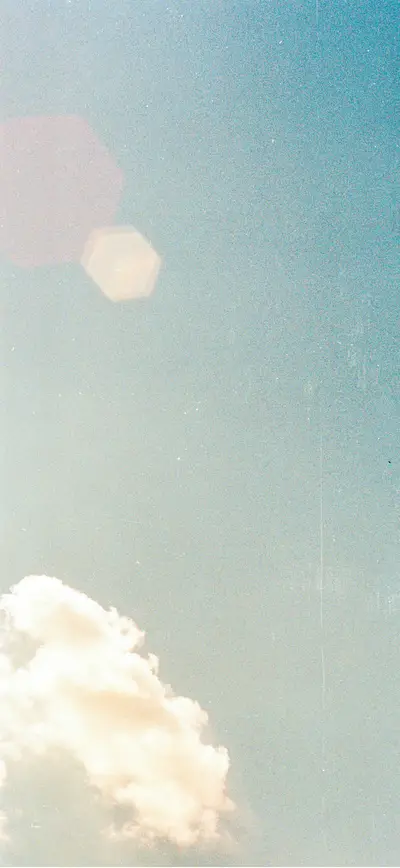 vintage film grain blue sky clouds