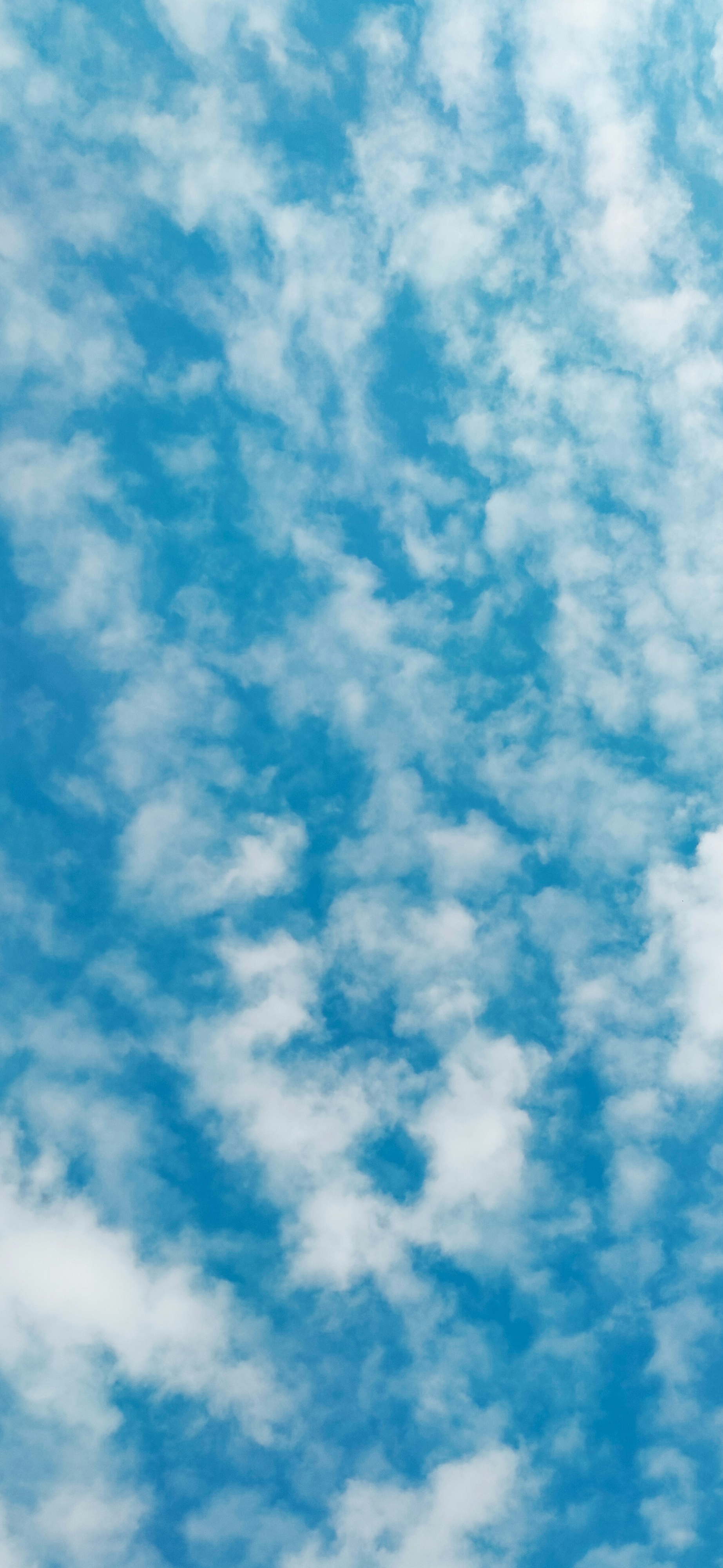bright blue sky white fluffy clouds