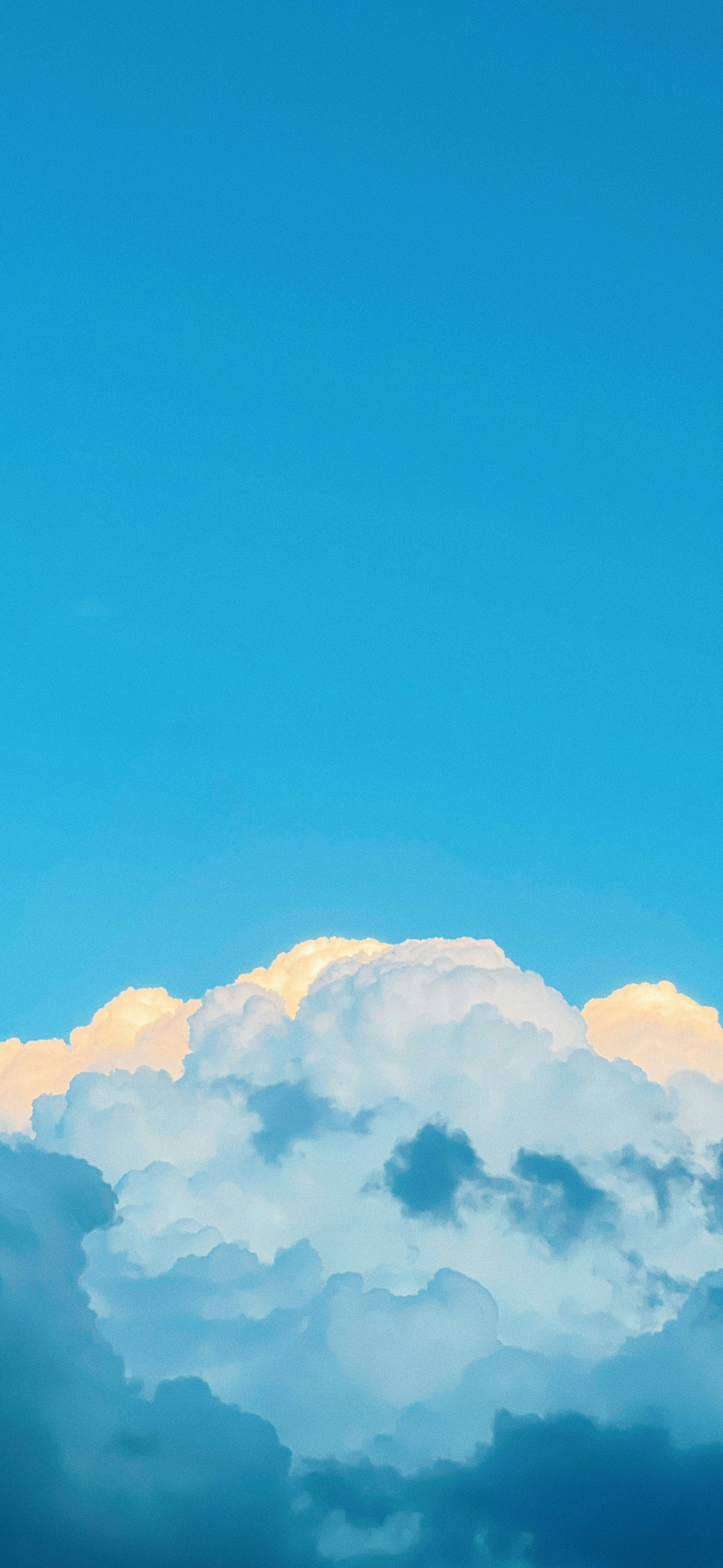 dreamy blue sky golden clouds