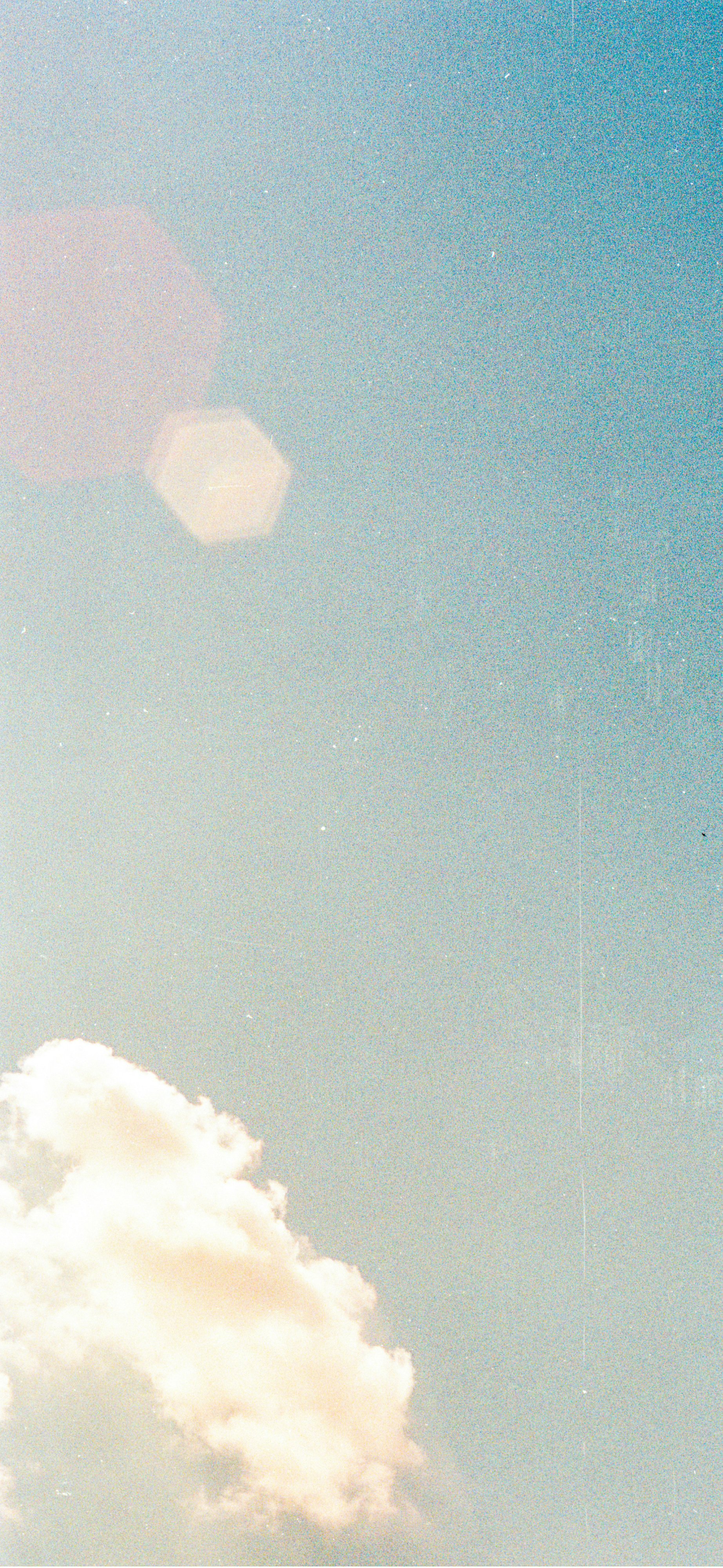 vintage film grain blue sky clouds